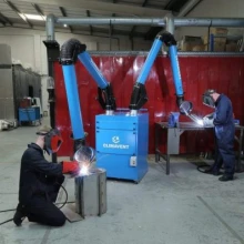 Mobile Fume Extraction Unit with double arms onto welding benches, the arms have a reach of 3 mtrs enabling the workers to work far enough apart that they do not impact each others work.