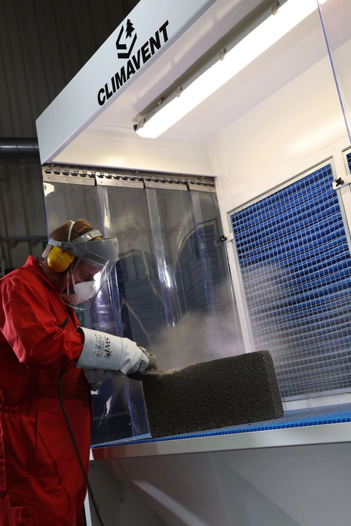 Stone Cutting Extraction with Back Draught Bench where the dust is collected into the filters at the rear of the bench, any heavy dust is dropped into the bins below