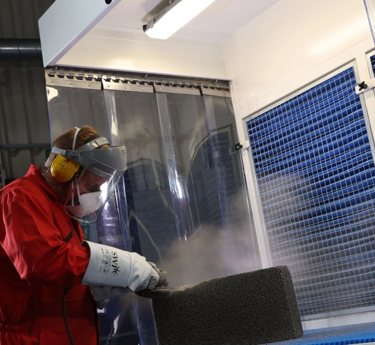 Stone Cutting Extraction with Back Draught Bench where the dust is collected into the filters at the rear of the bench, any heavy dust is dropped into the bins below