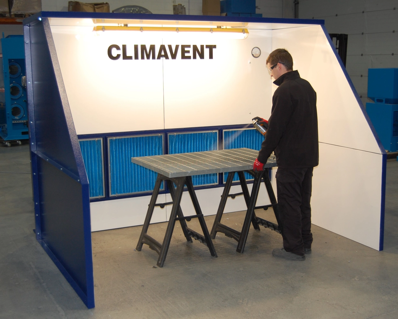 Aerosol extraction using a low profile booth with external extraction unit